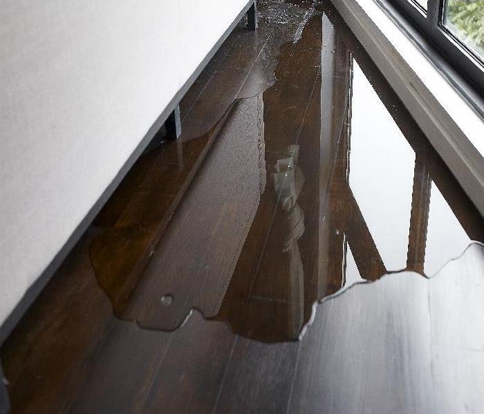 Water leaking and flooded on wood parquet floor