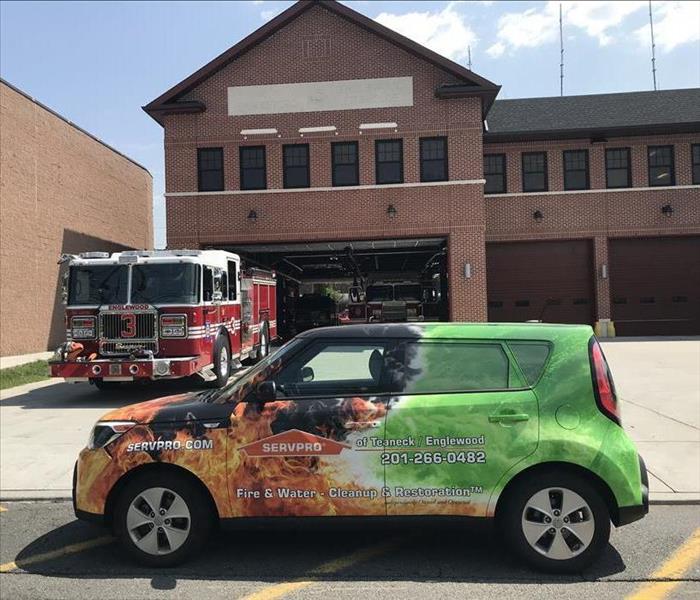 servpro vehicle in front of fire house