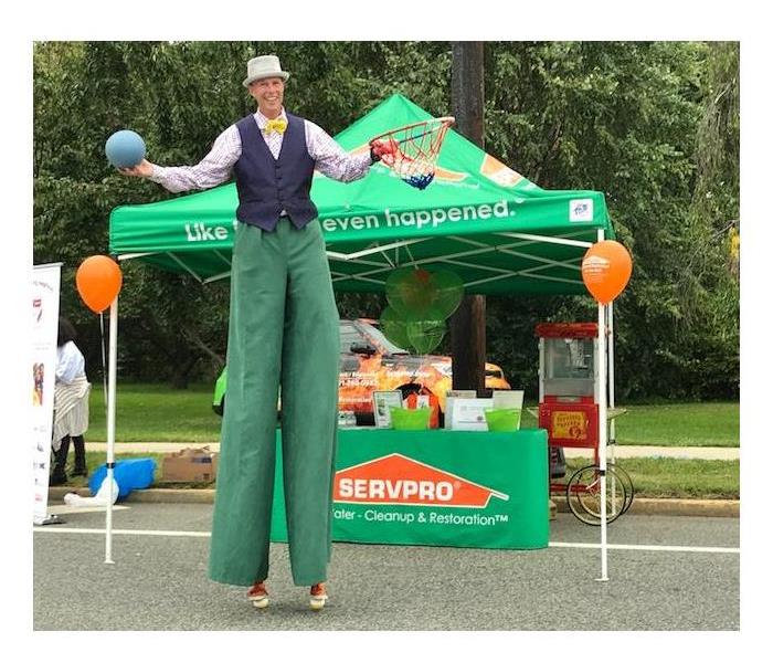 event member on stilts. servpro